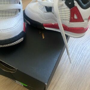 Red black and white shoe Jordan’s 4c